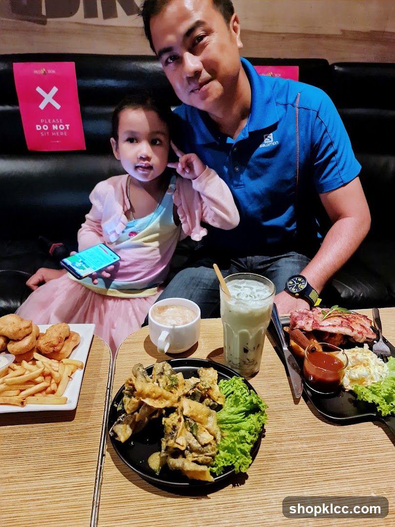 Father and Daughter Enjoying a Meal