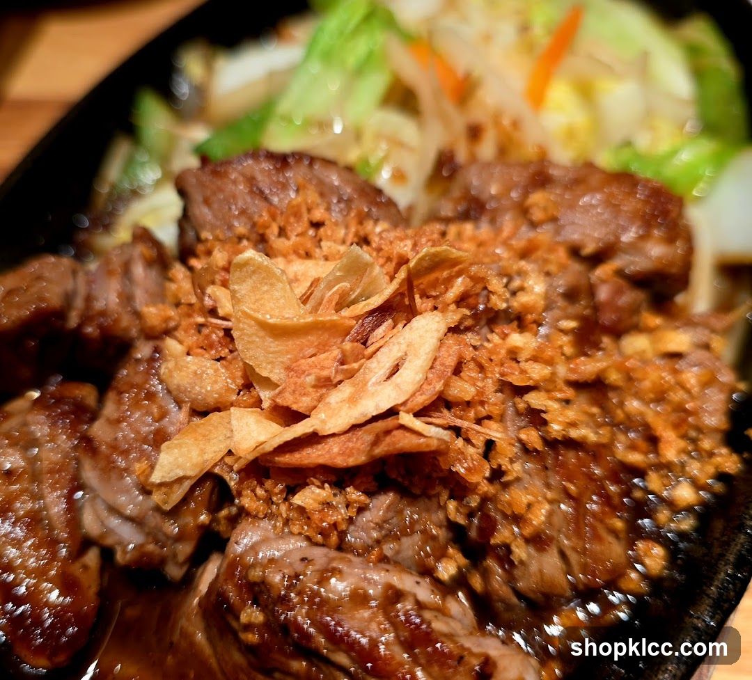 Sizzling Steak with Crispy Garlic and Vegetables