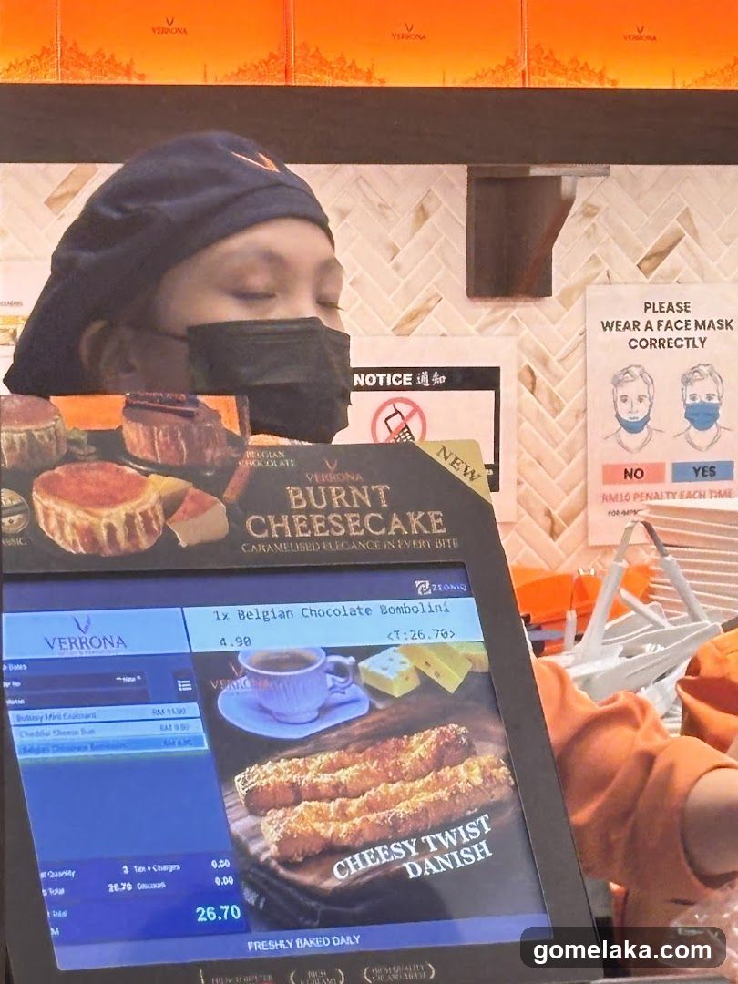 Staff at counter with digital display