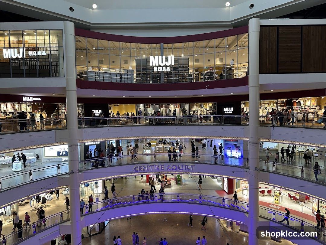 Multi-level shopping mall interior with MUJI stores