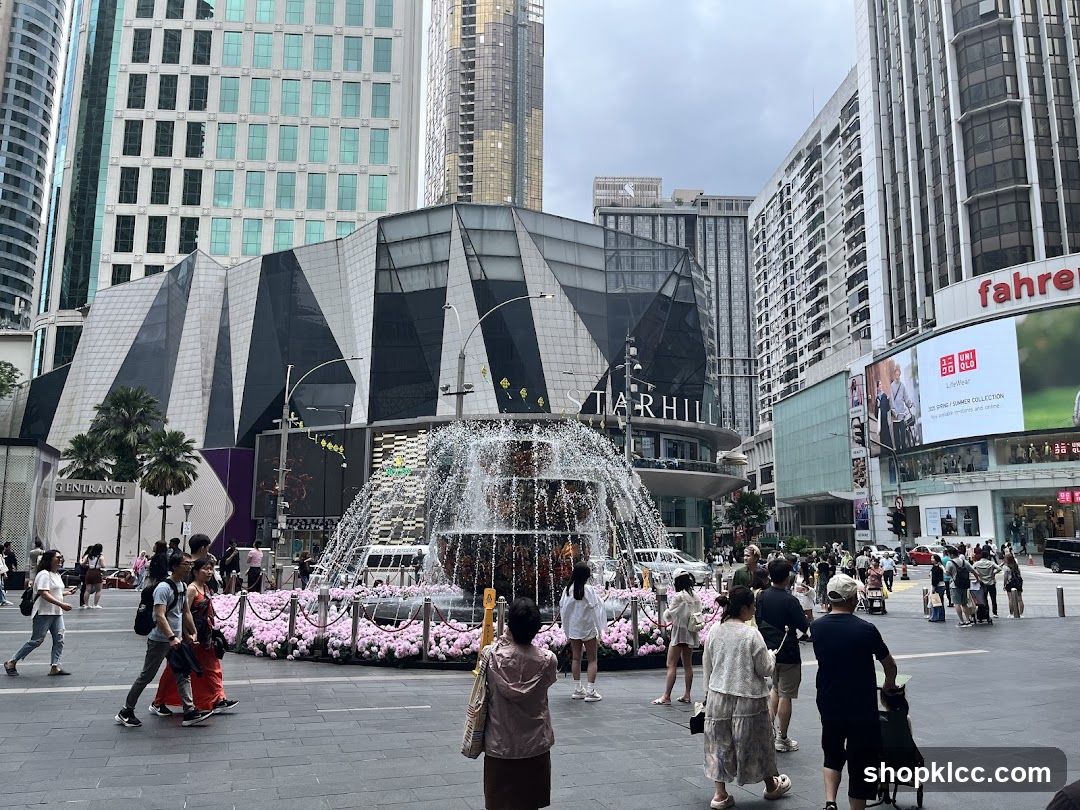 Outdoor plaza with fountain and surrounding buildings