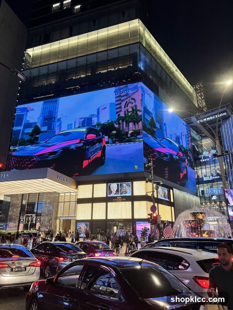 Busy City Street at Night with Large Digital Billboard