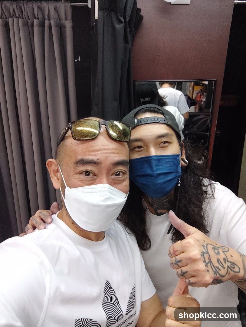 Two men posing for a selfie