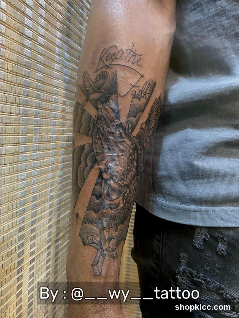 Tattoo of Praying Hands with Doves and Cross