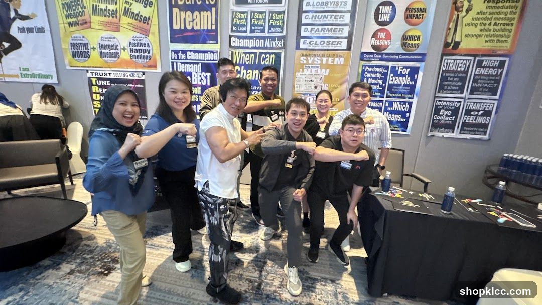 Group posing with motivational posters