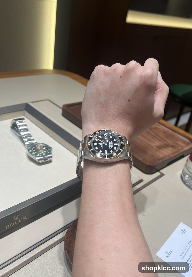 Person wearing a Rolex watch
