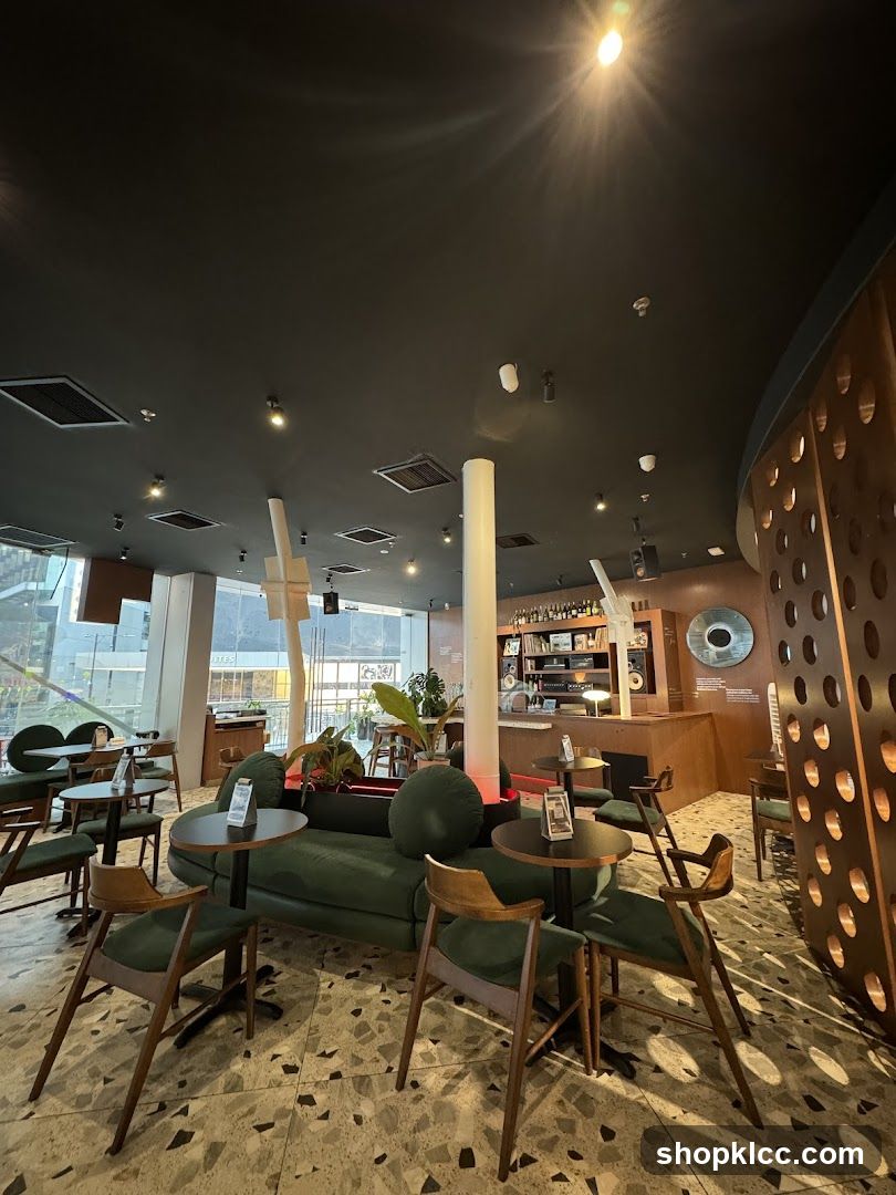 Modern Cafe Interior with Green Seating