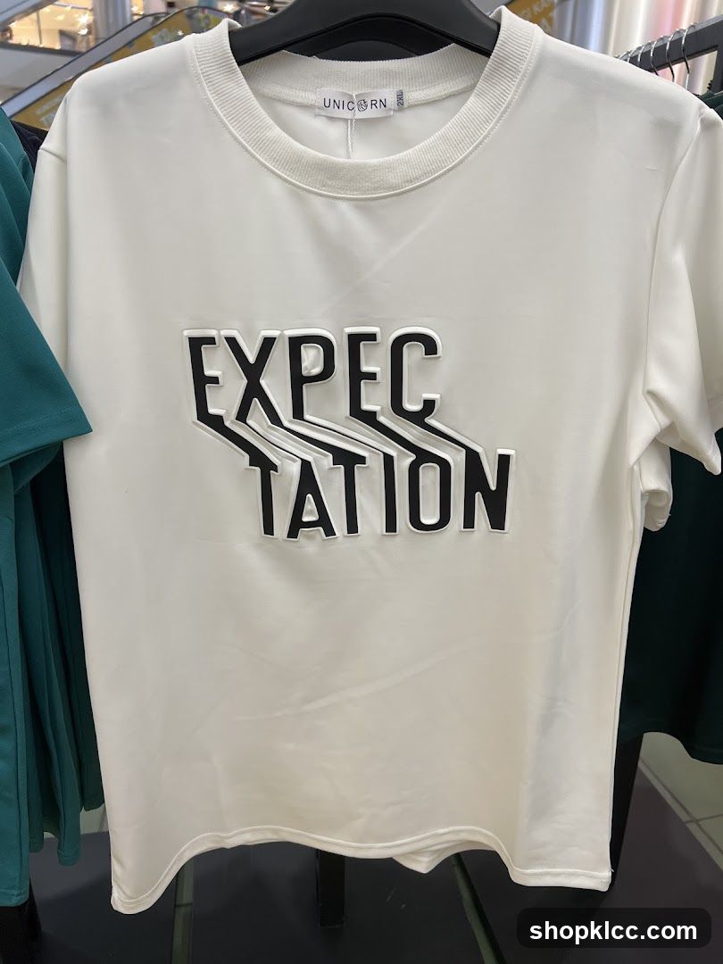 White T-shirt with "EXPECTATION" graphic