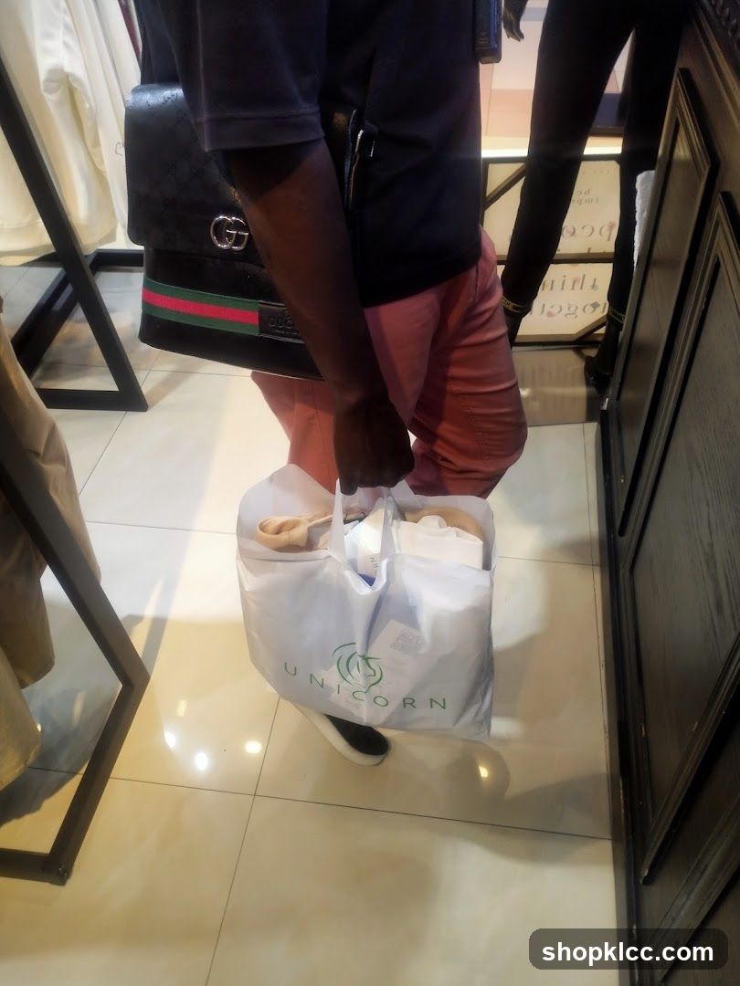 Person carrying shopping bags