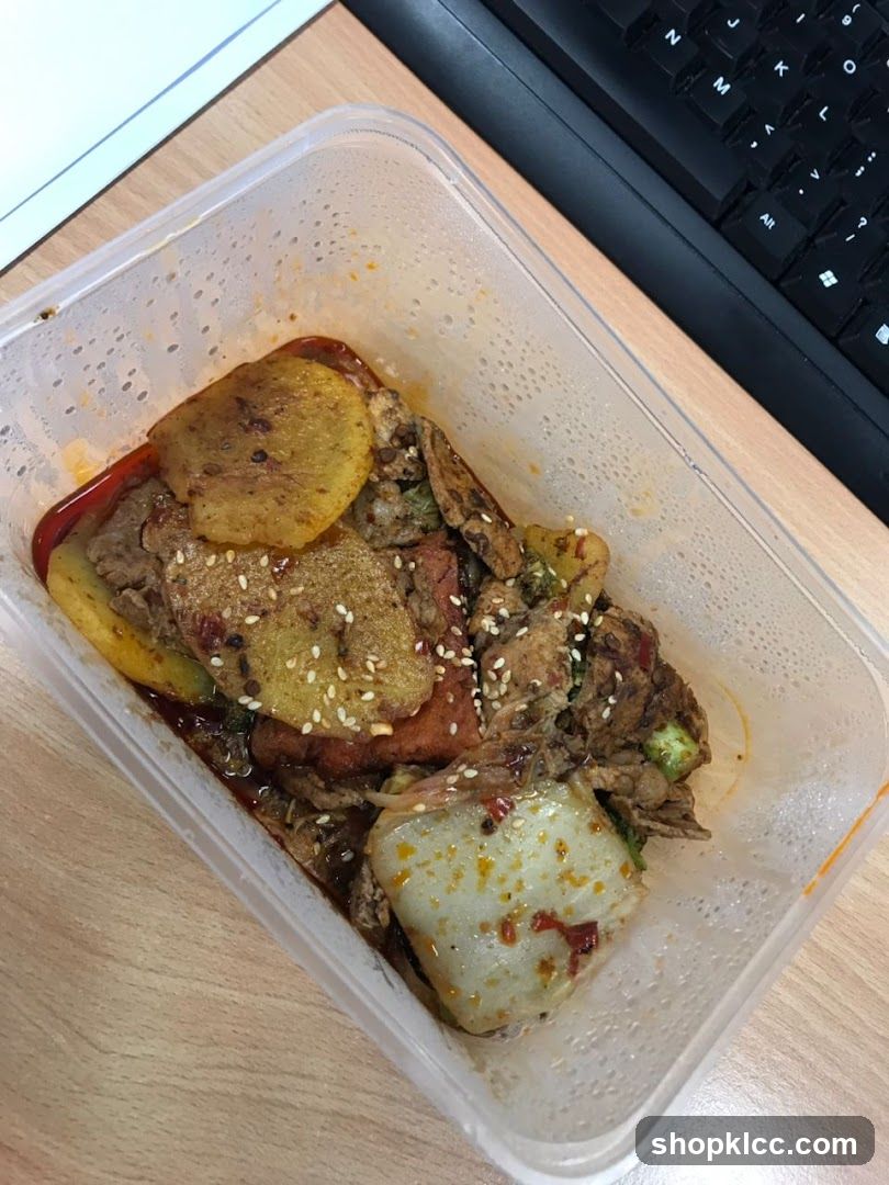 Spicy Stir-Fried Dish in Takeout Container