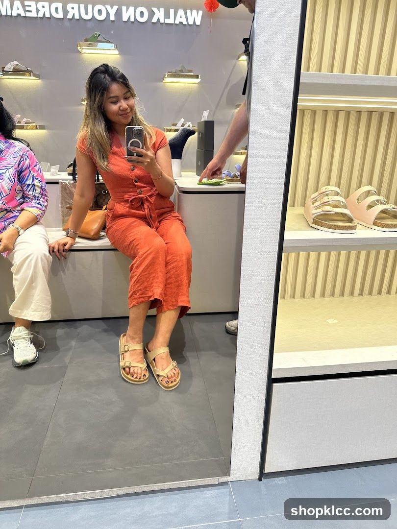 Woman trying on sandals in a shoe store