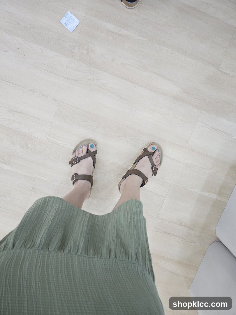 Feet in Sandals and Green Dress