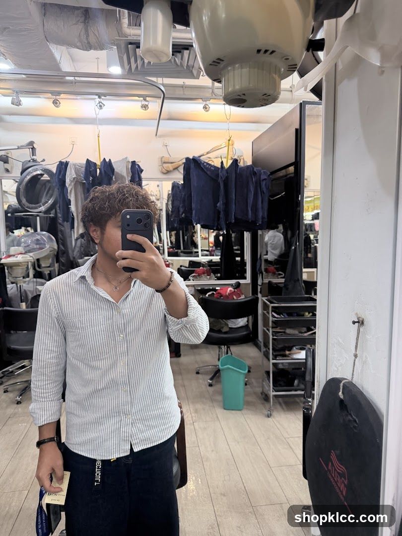 Man taking a selfie in a salon