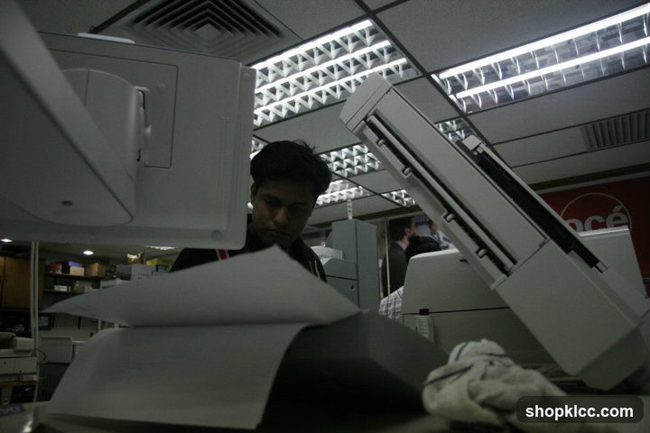 Man working with a copier