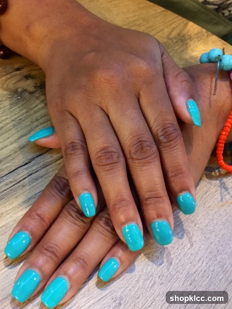 Hands with Teal Nail Polish