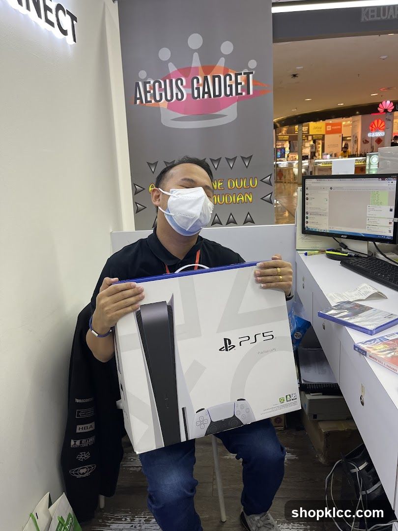 Man holding a PlayStation 5 box