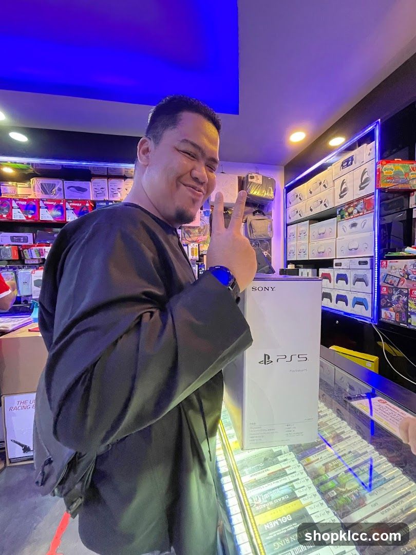 Man with PlayStation 5 box