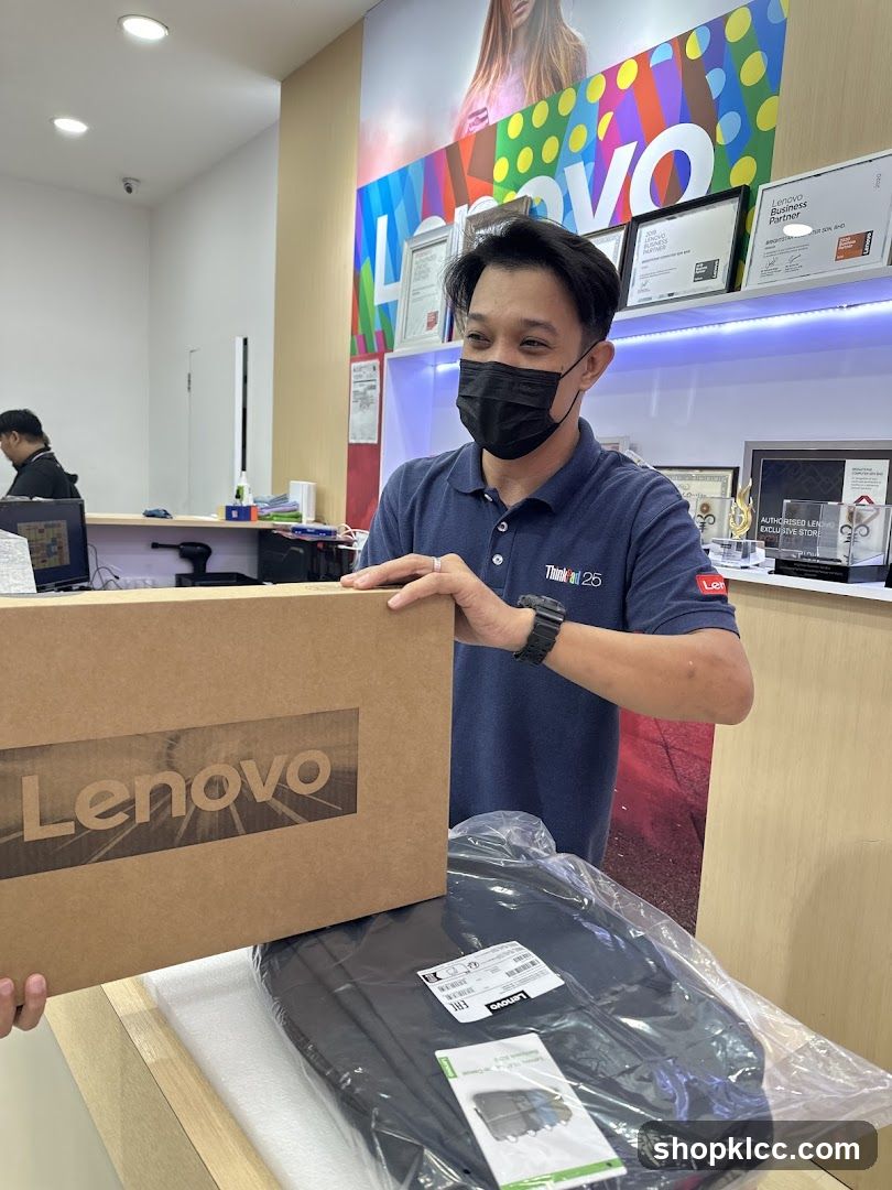 Lenovo Store Employee with Laptop Box