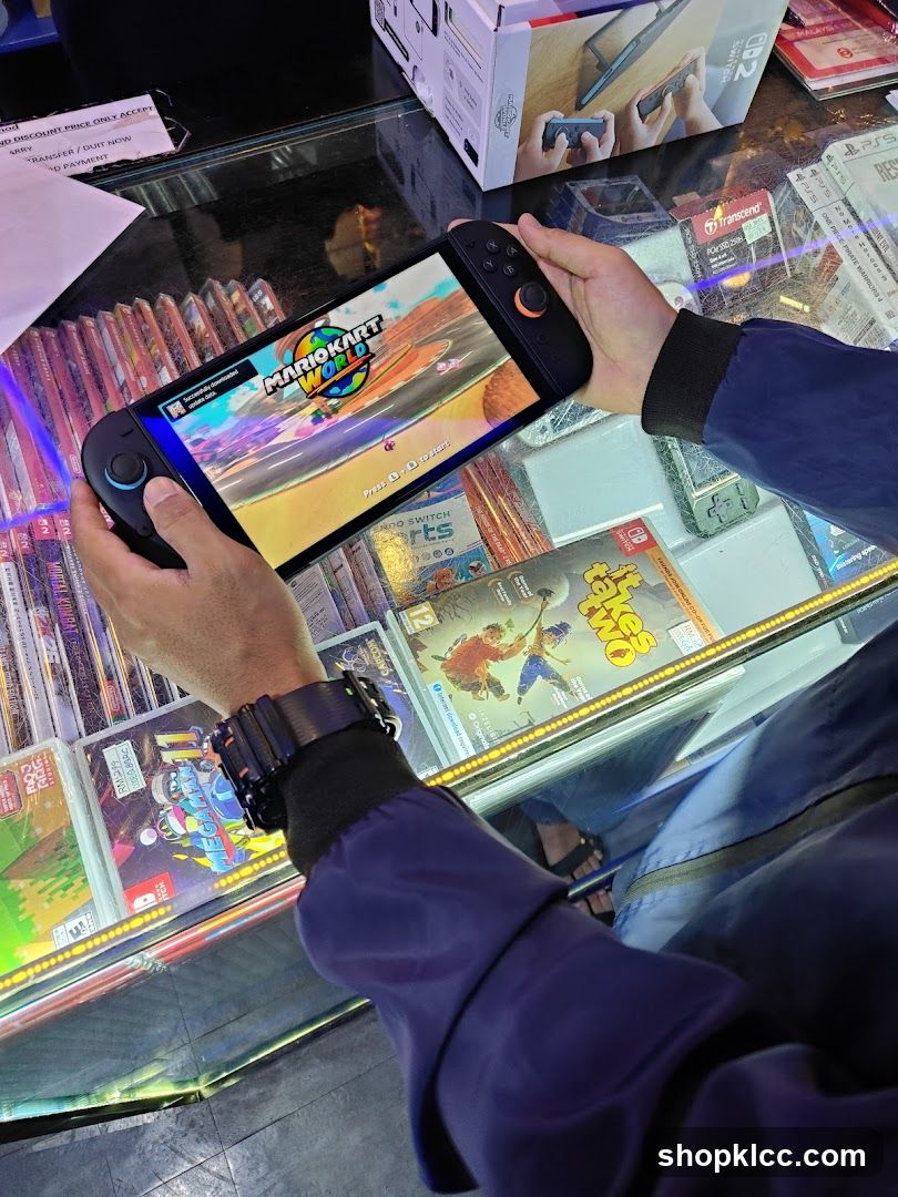 Person holding a handheld gaming console