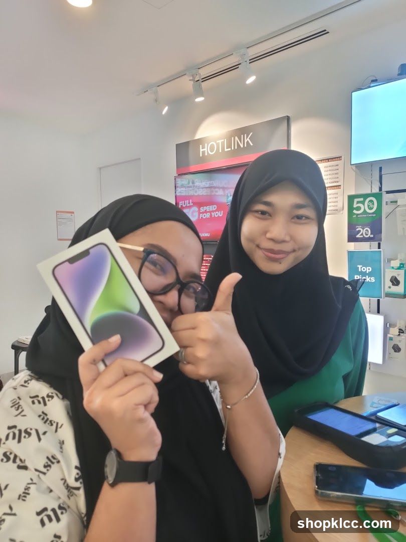 Two women with a new phone