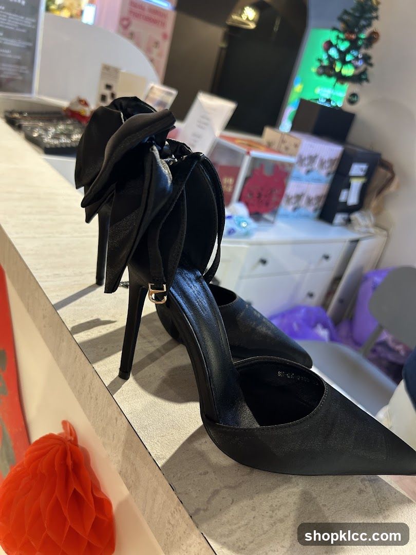 Black high heels with bow detail