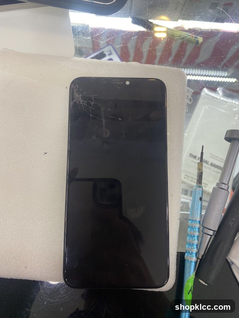 Cracked Phone Screen and Repair Tools
