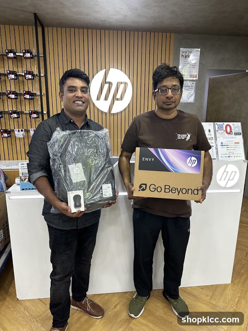Two men holding HP products