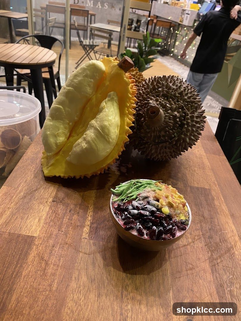 Durian and dessert on a wooden table