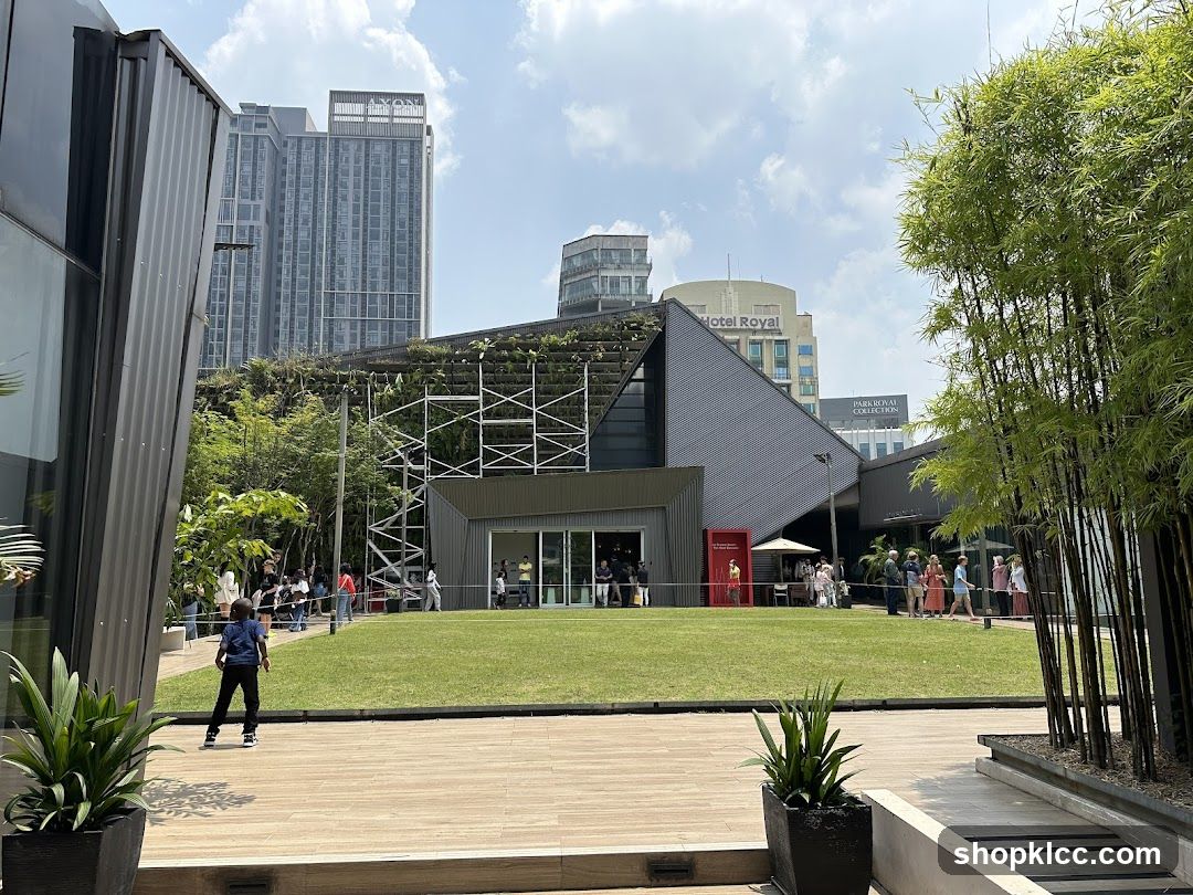 Modern Building with Greenery and People