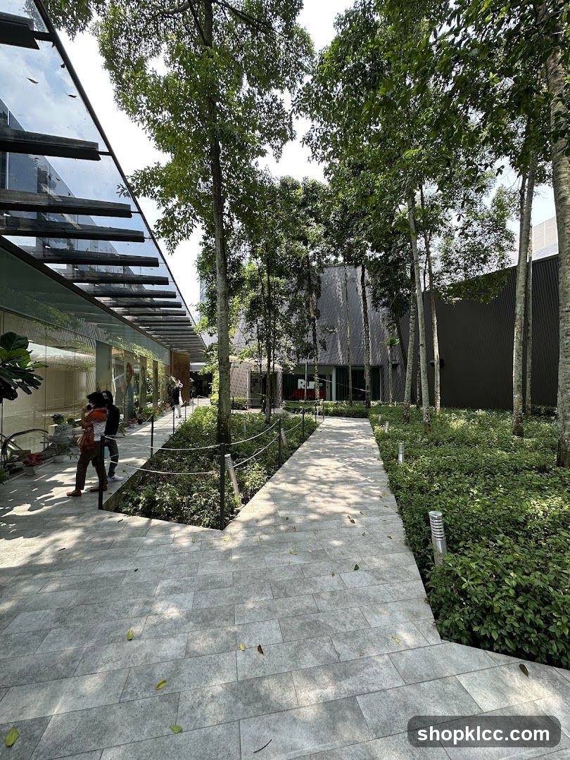 Outdoor walkway with trees and modern architecture
