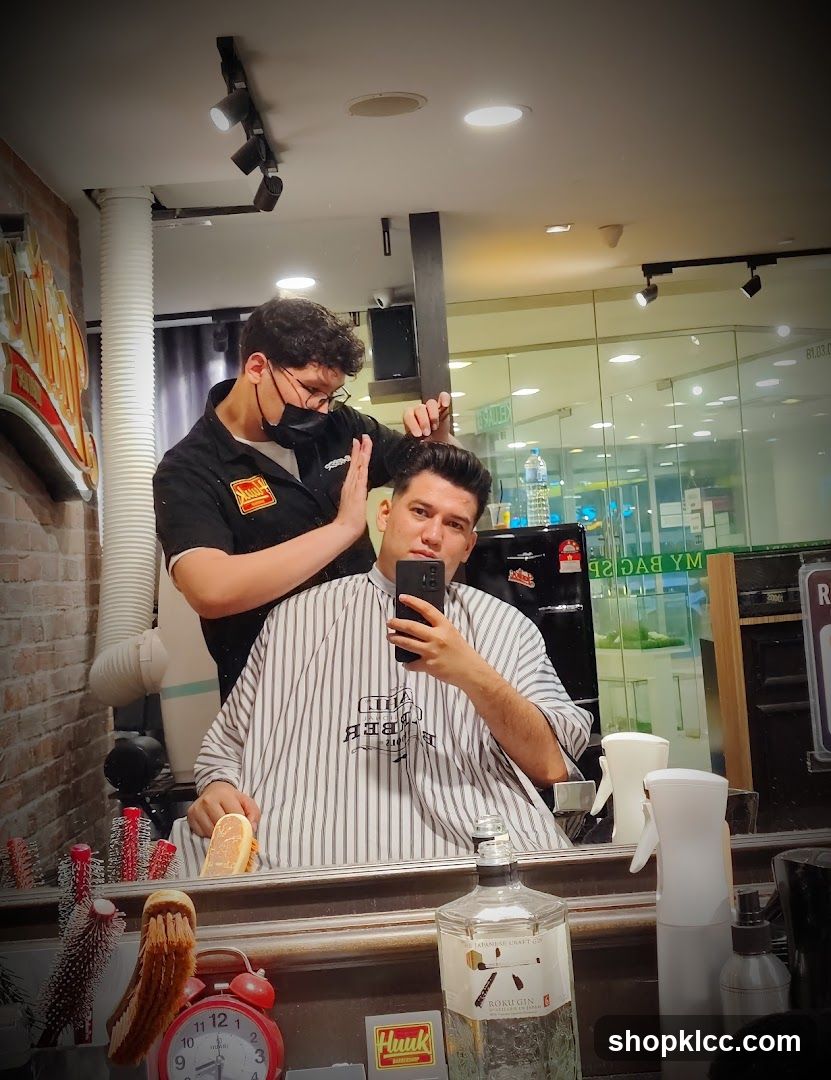 Barber cutting client's hair