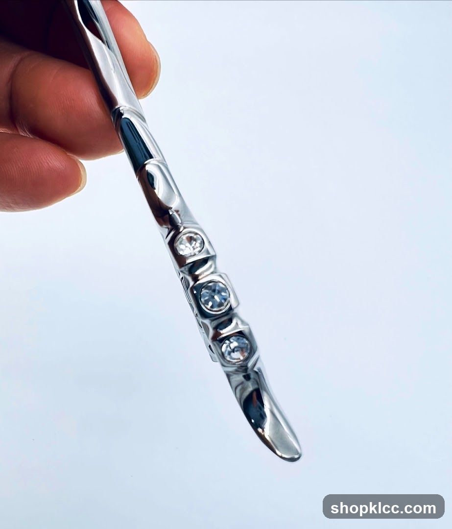 Close-up of a silver hair scissor with rhinestones