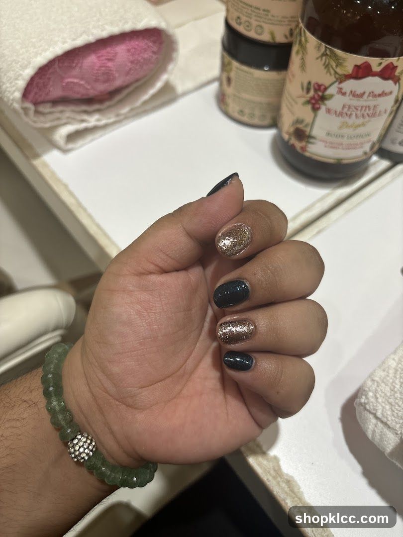 Hand with Glitter and Dark Nail Polish