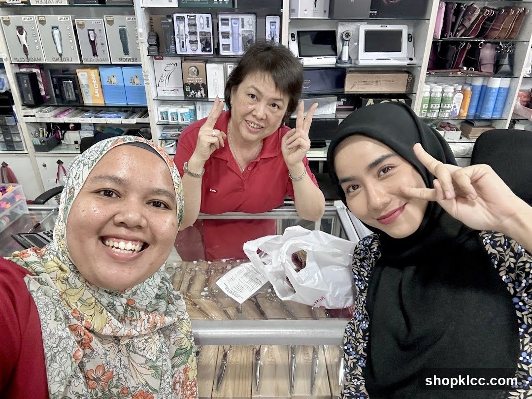 Three people posing for a selfie in a store
