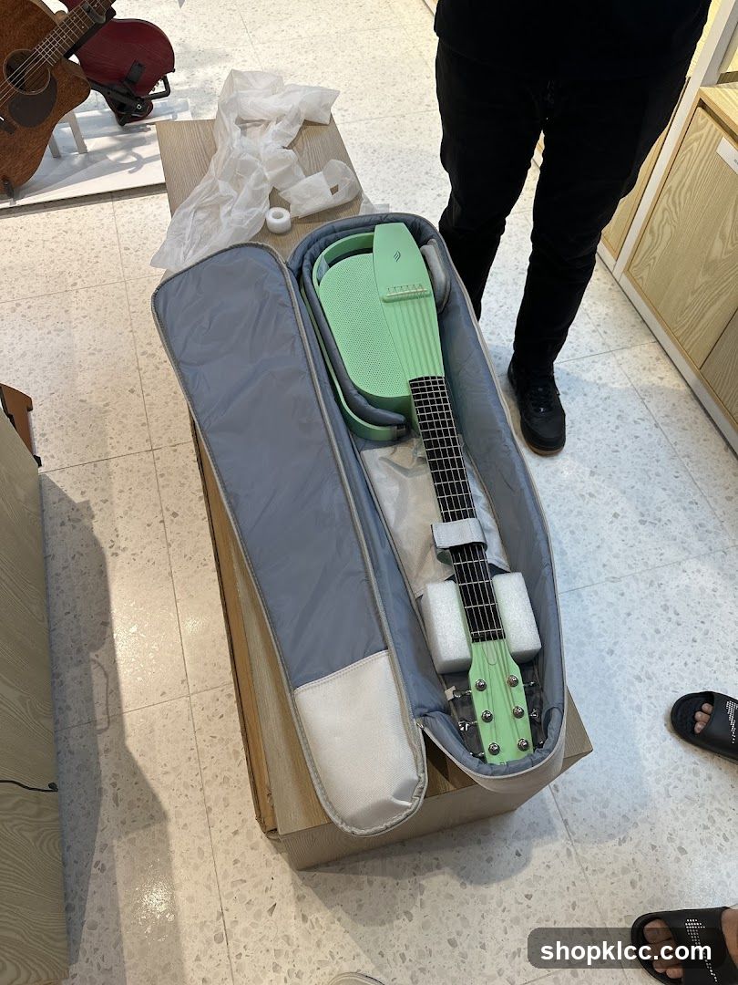 Unboxing a light green guitar