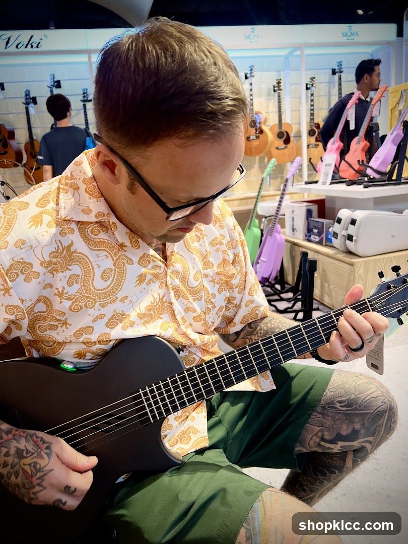 Man playing a guitar in a store