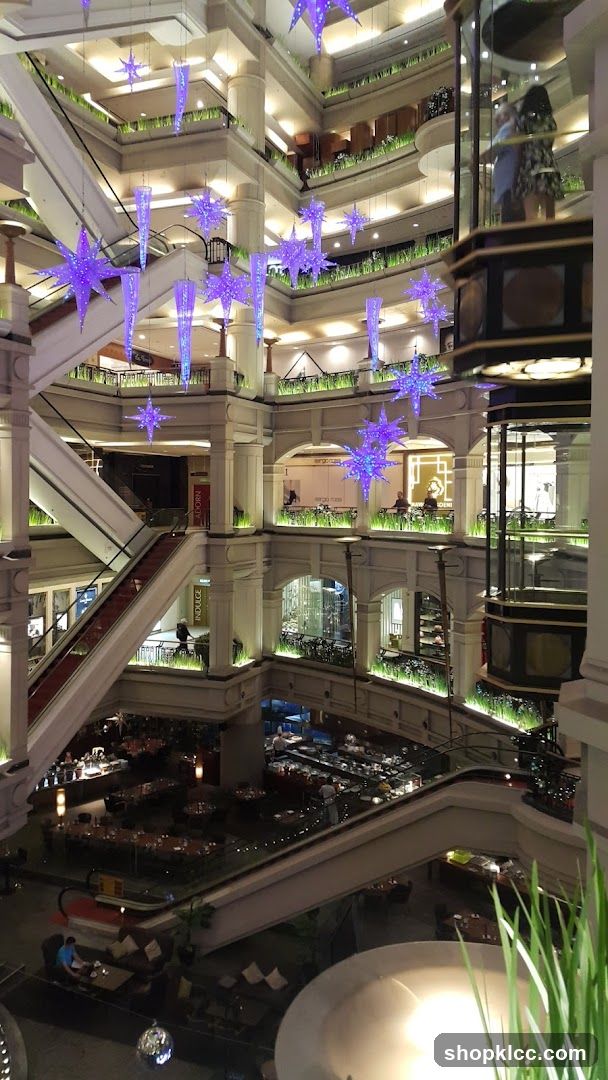 Interior of a multi-level shopping mall with festive decorations