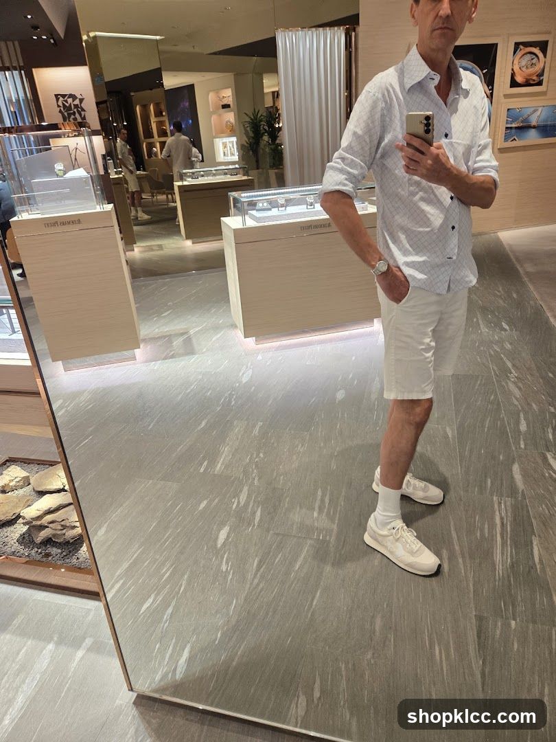 Man taking a selfie in a luxury watch store