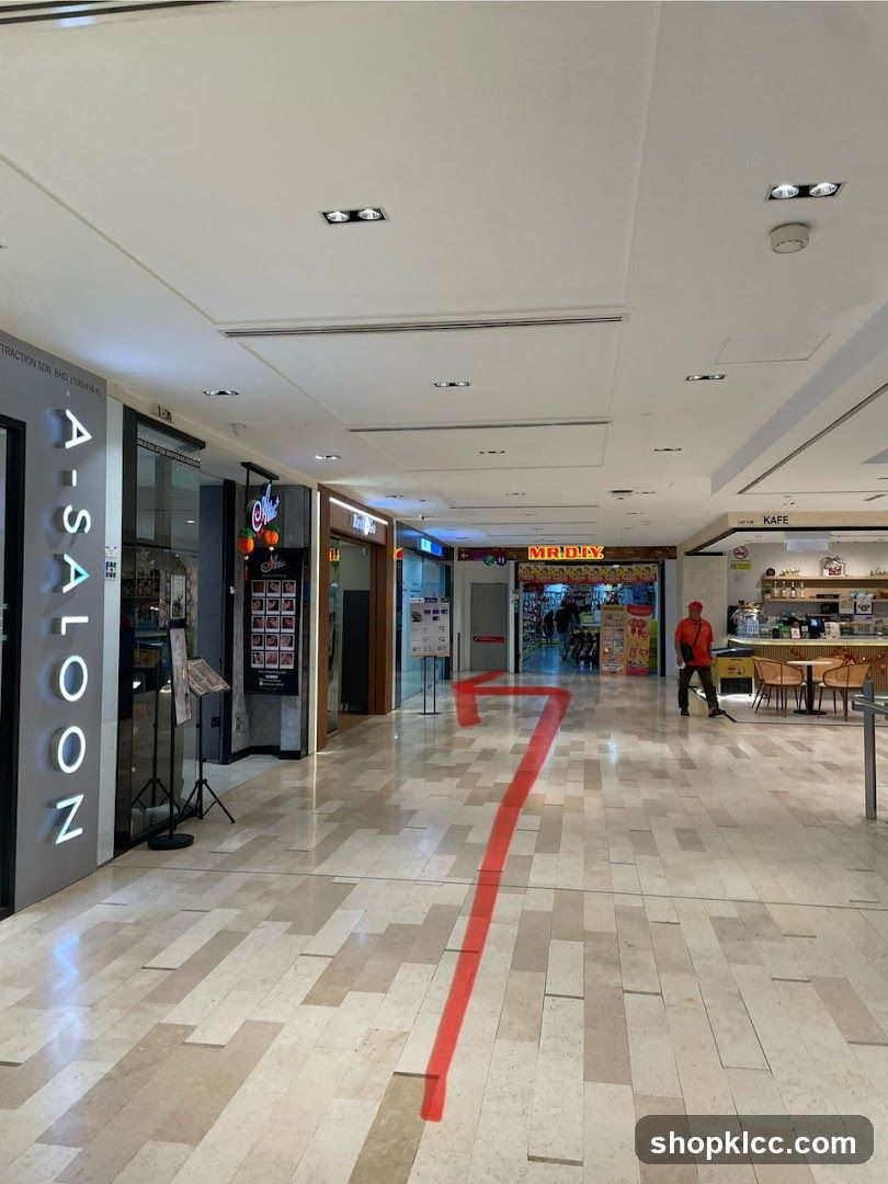 Mall Interior with Shops and Directional Arrow