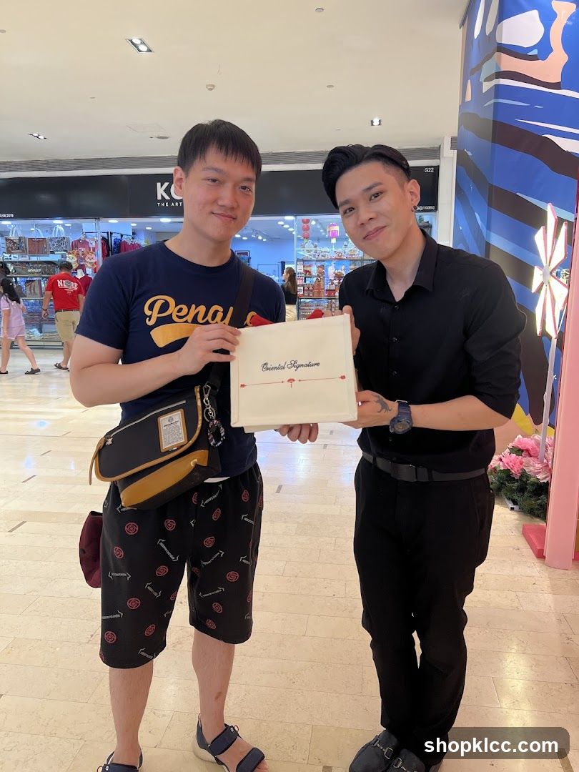 Two men holding a box