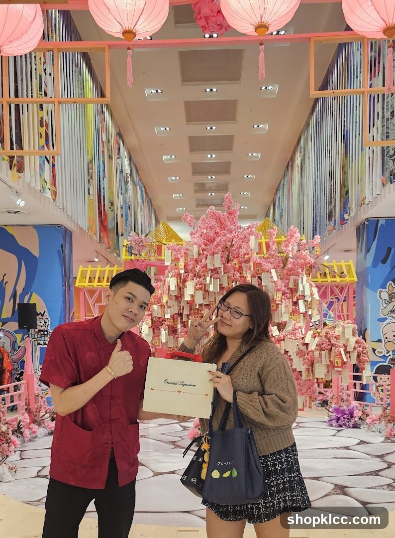 Couple Poses with Gift Box in Festive Setting