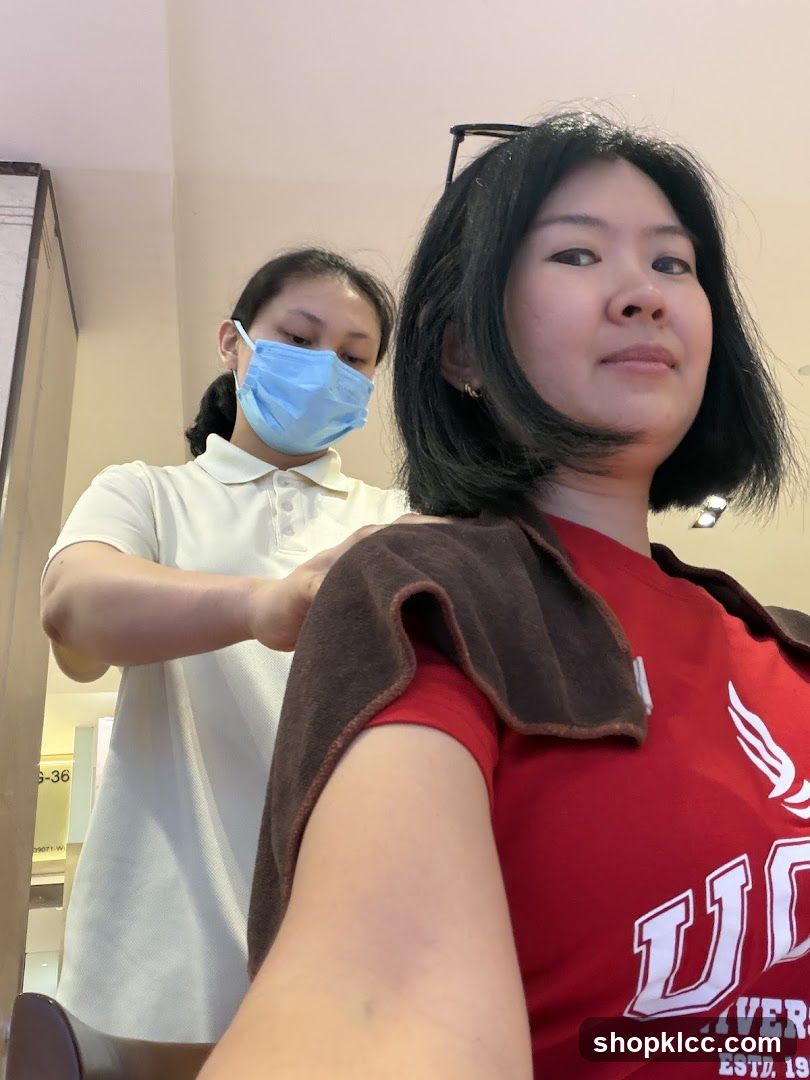 Hairdresser working on client
