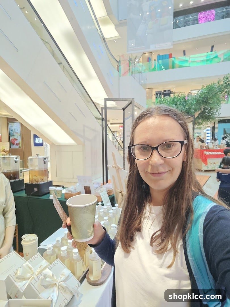 Woman holding a cup at a market stall