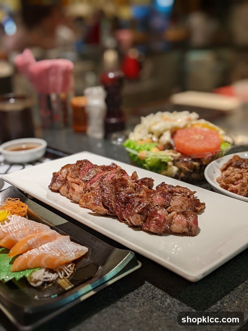Slices of steak and salmon sashimi