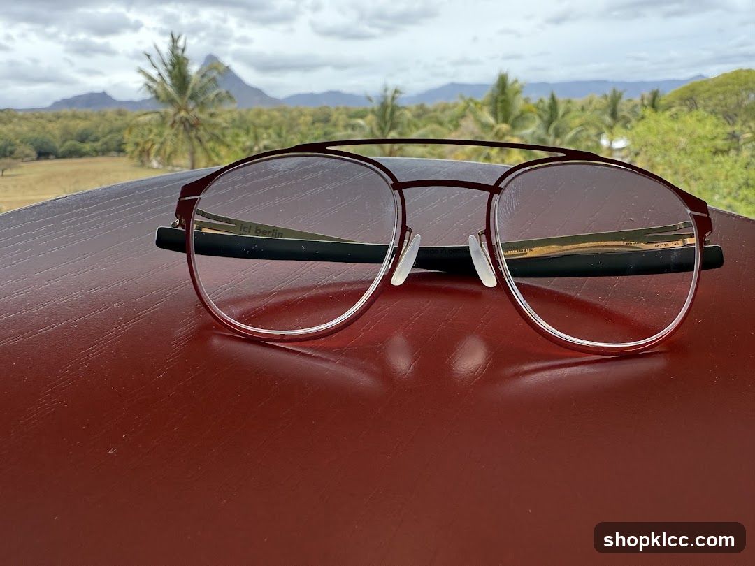 Eyeglasses on a table with a scenic background