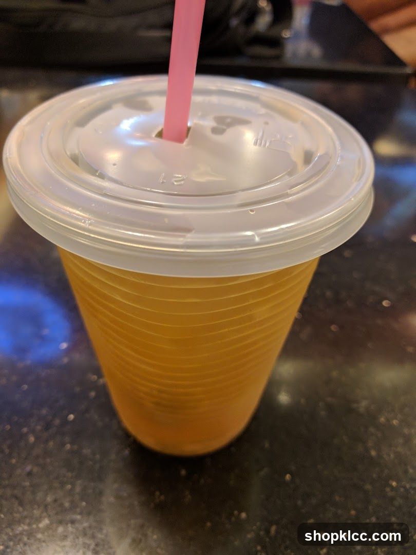 Orange Drink in a Plastic Cup