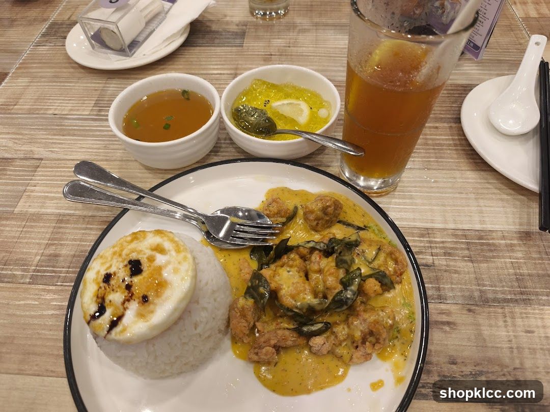 Curry Chicken Rice with Fried Egg and Drink
