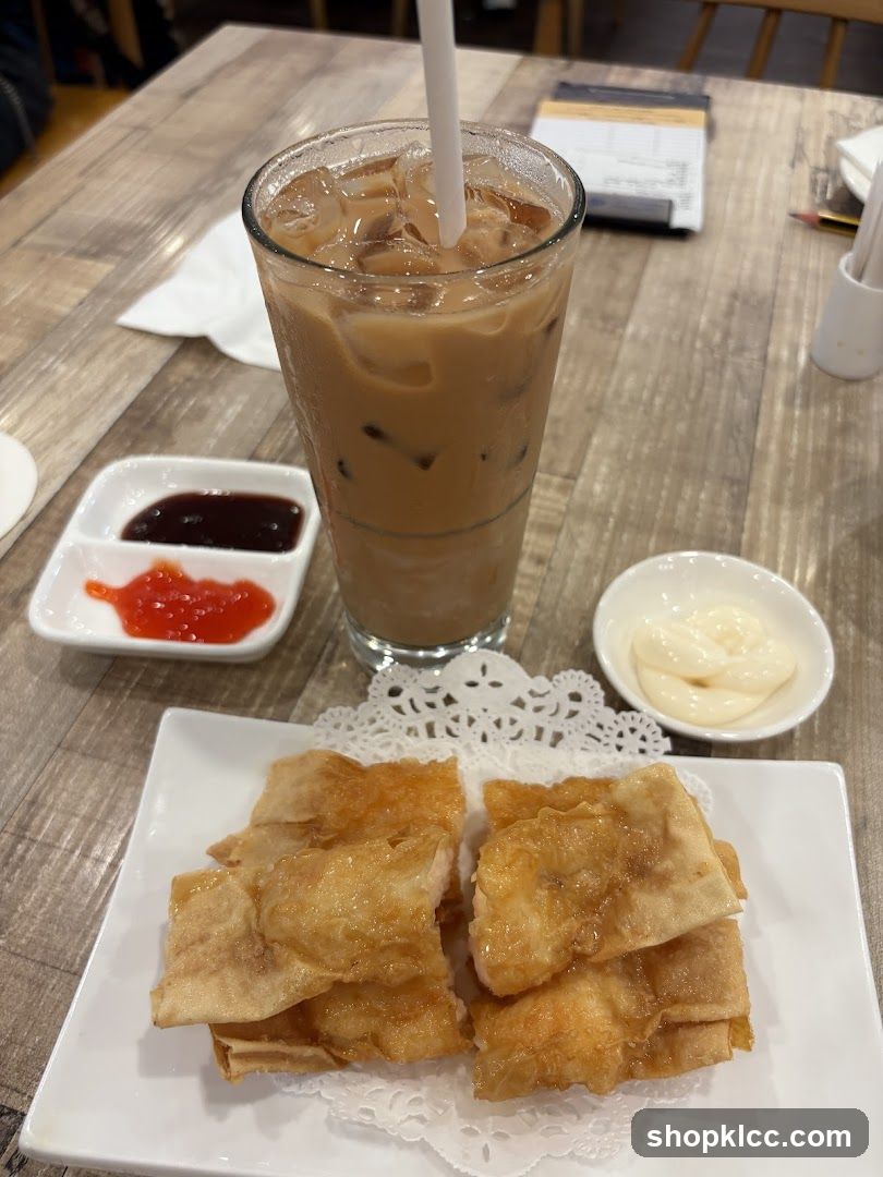 Fried Food with Iced Coffee and Condiments