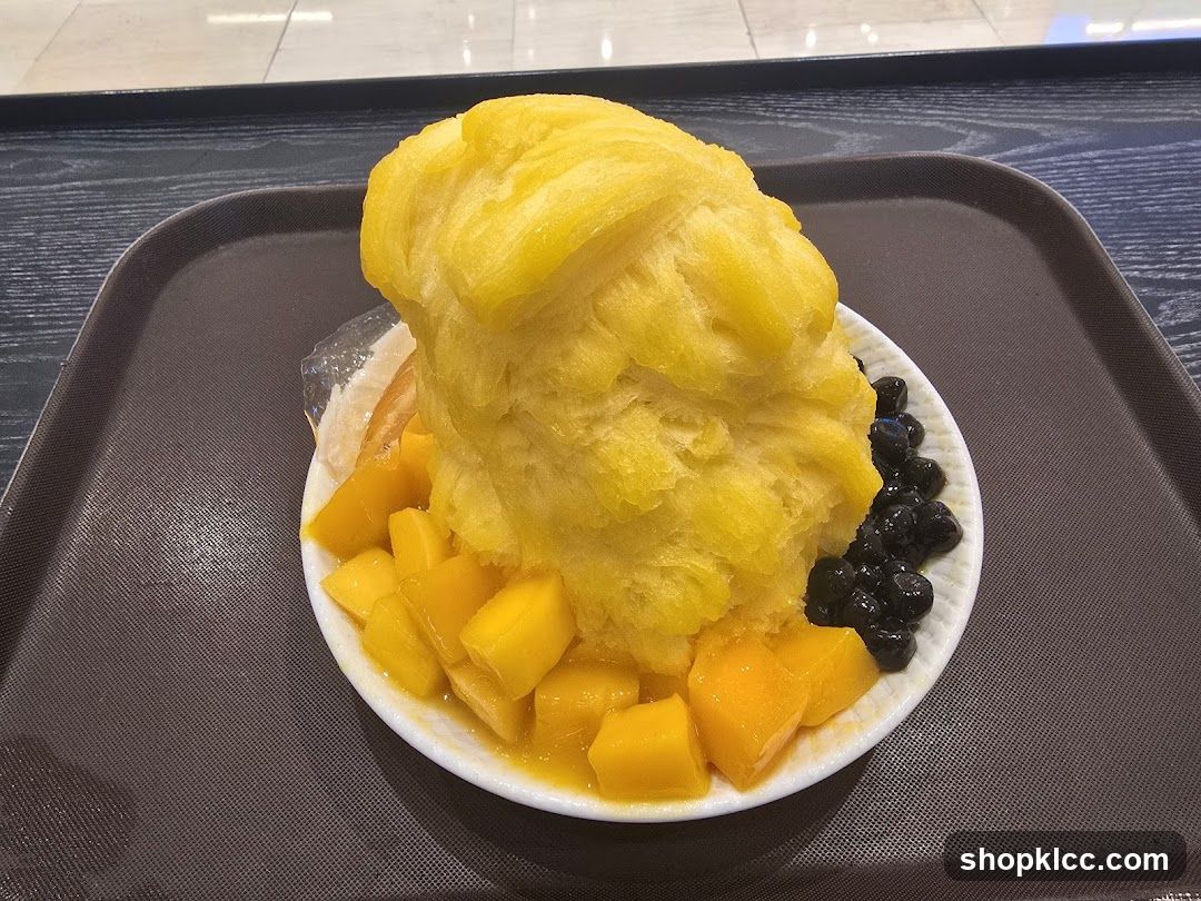 Mango shaved ice with boba and mango chunks