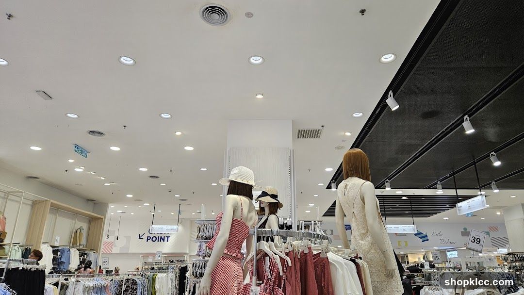 Clothing store interior with mannequins and clothing racks